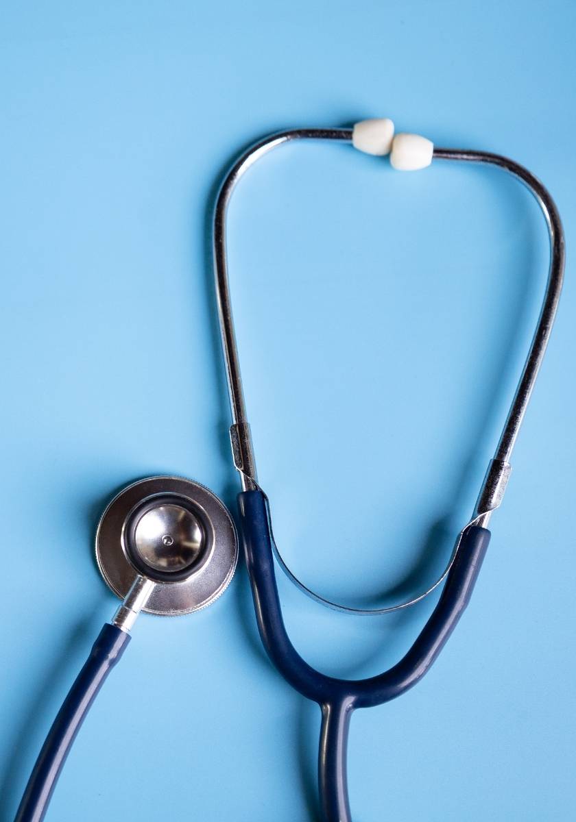 Stethoscope on a clean blue medical background